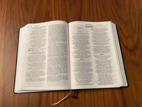 Chuukese Print Bible open on wood table